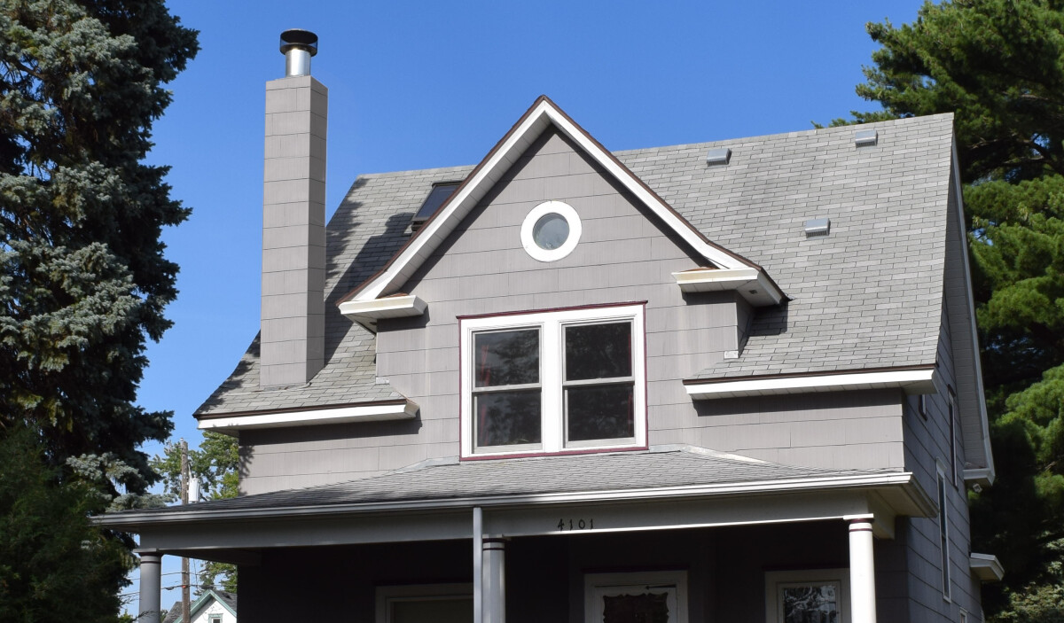 A mockup of the chimney with matching siding