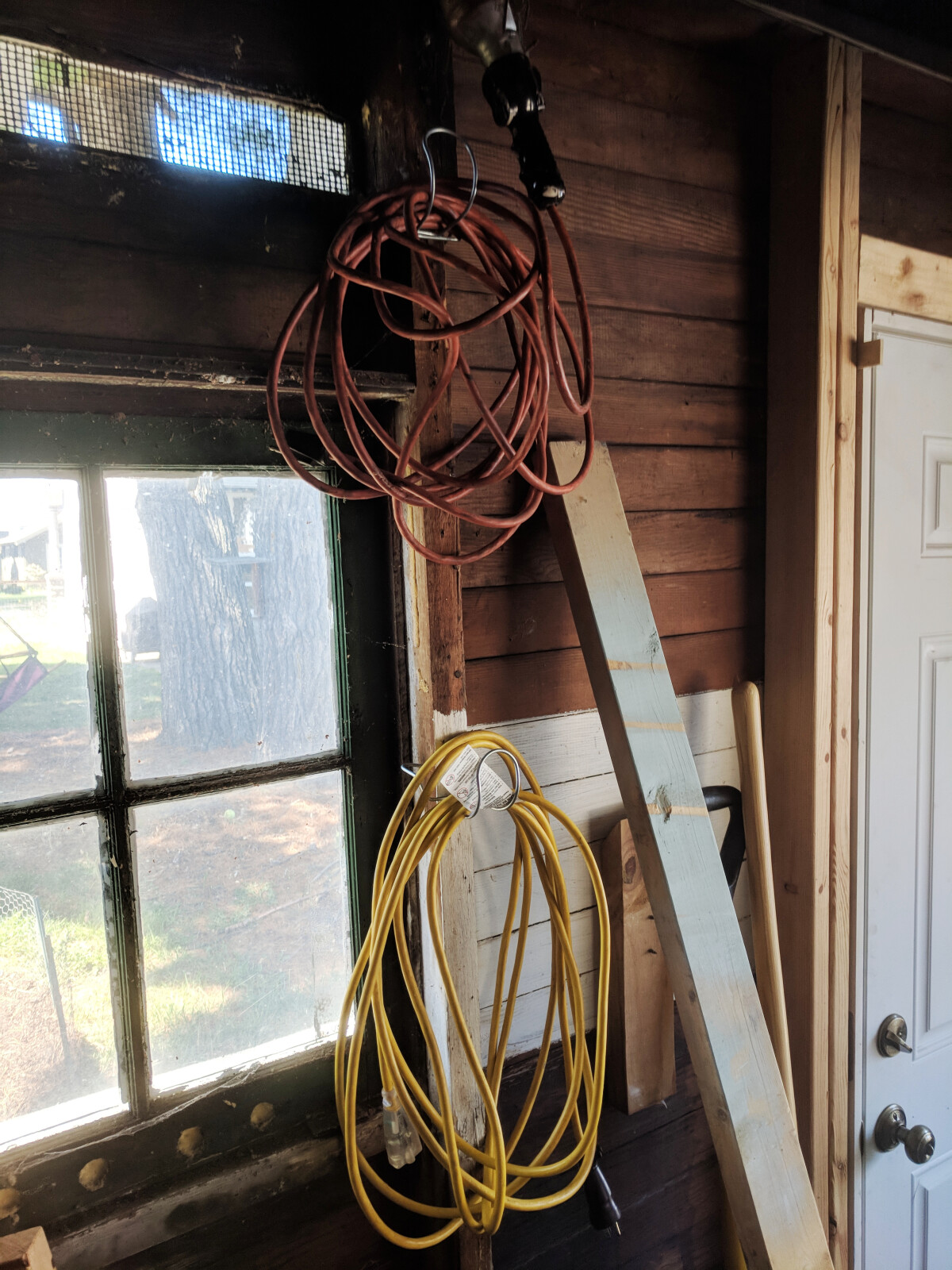 Storage hooks holding extension cords