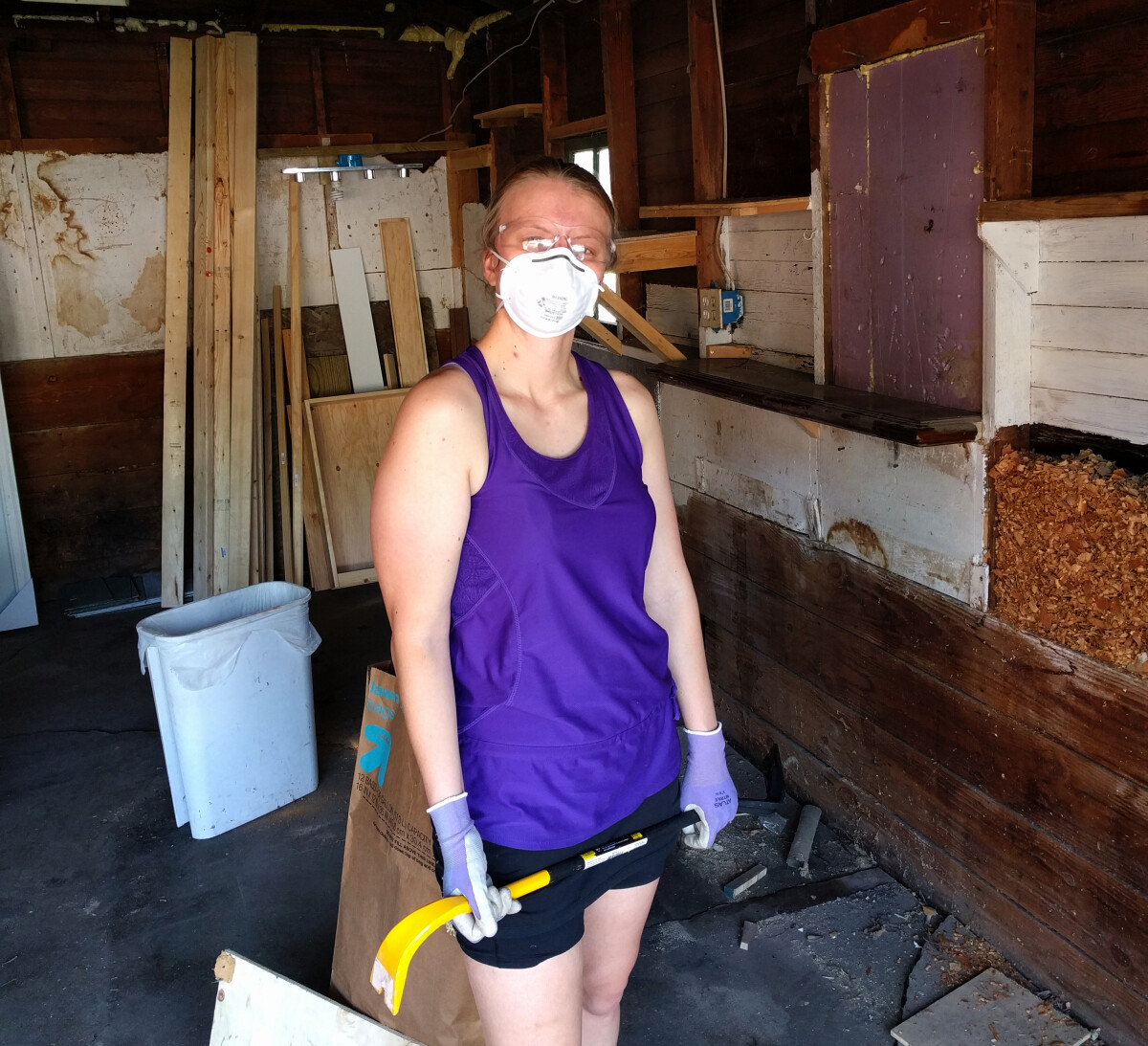 Katherine with safety gear working on demo in the garage