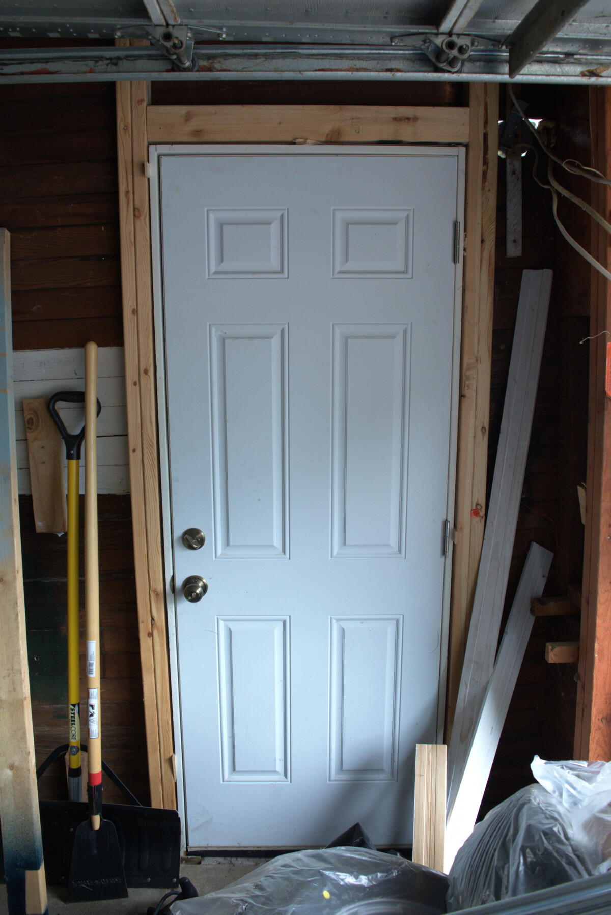 The new door viewed from the garage interior
