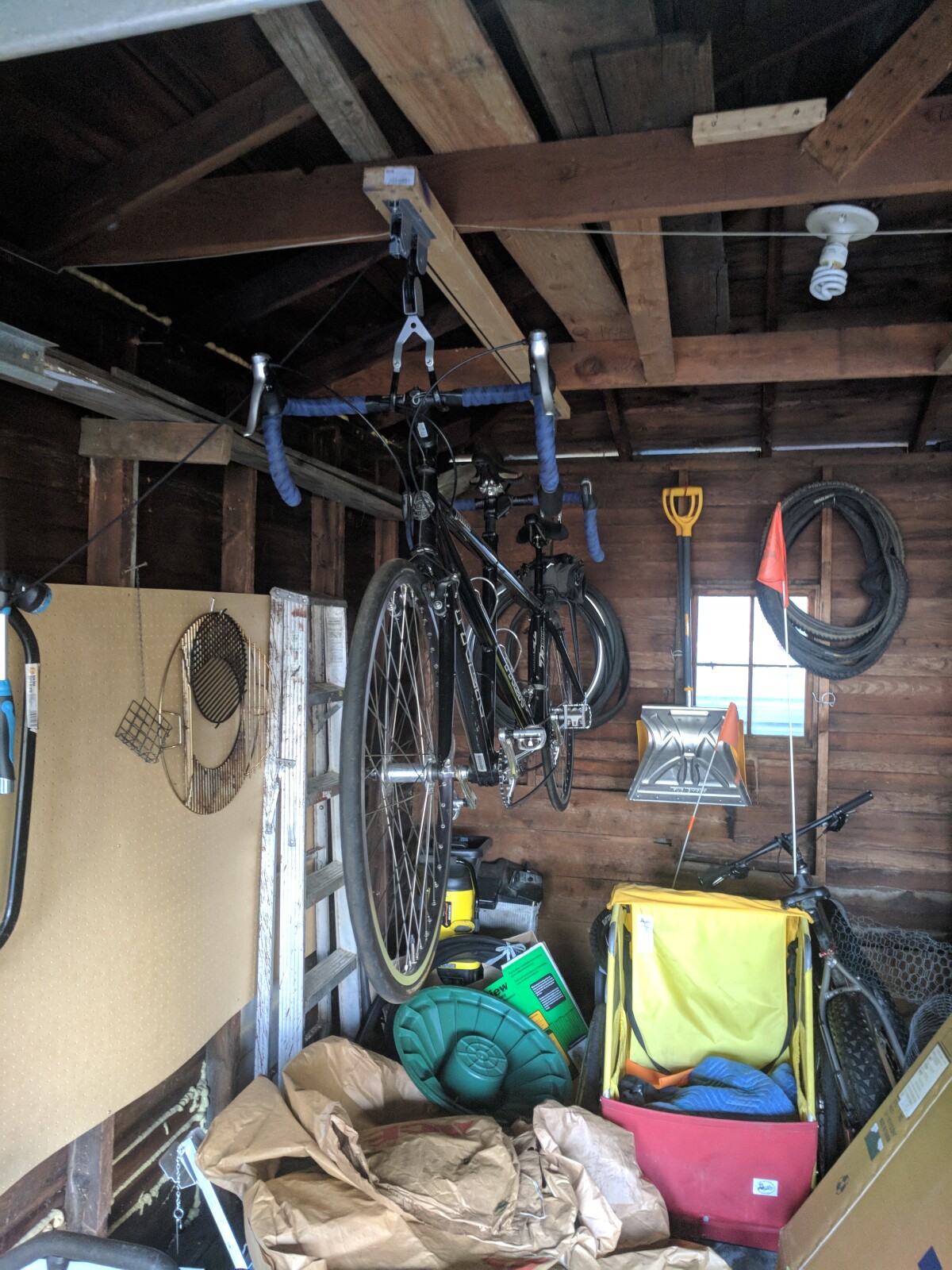 Tandem bike hanging from ceiling hoist
